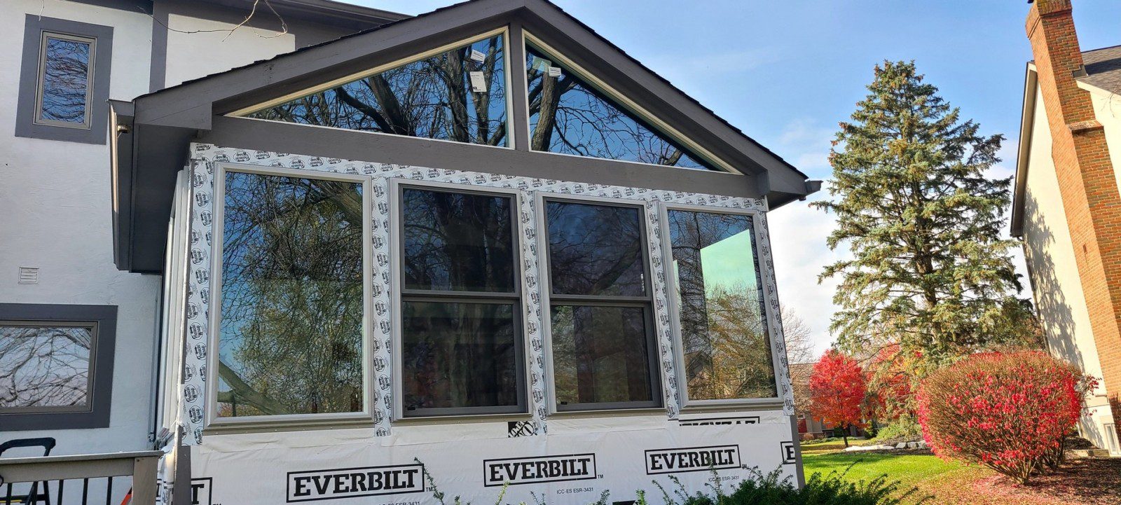 Residential porch enclosure with new windows – home improvement project