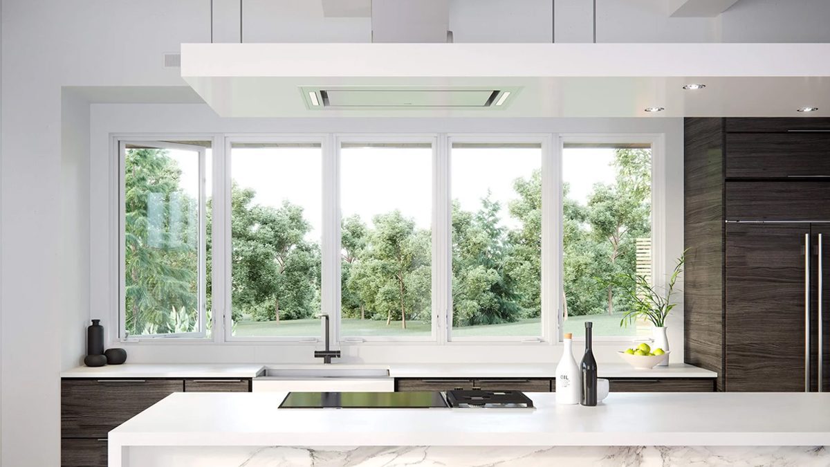 Modern kitchen with large white windows, providing abundant natural light