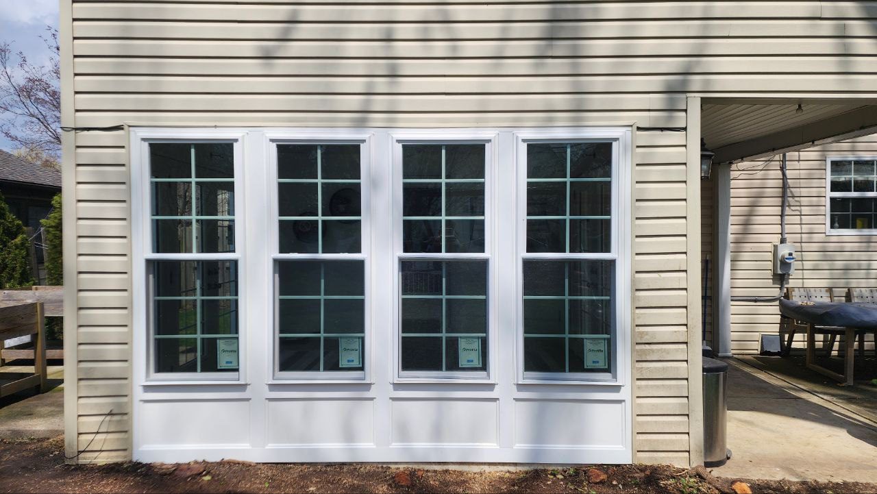 Residential vinyl windows with grid pattern after replacement
