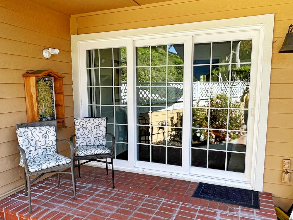 White sliding patio doors with grid-style glass panels