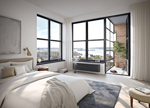 Modern bedroom with large black-framed floor-to-ceiling windows and a glass door leading to a balcony