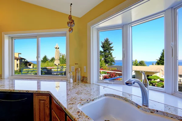 Large white vinyl kitchen windows with a bay design