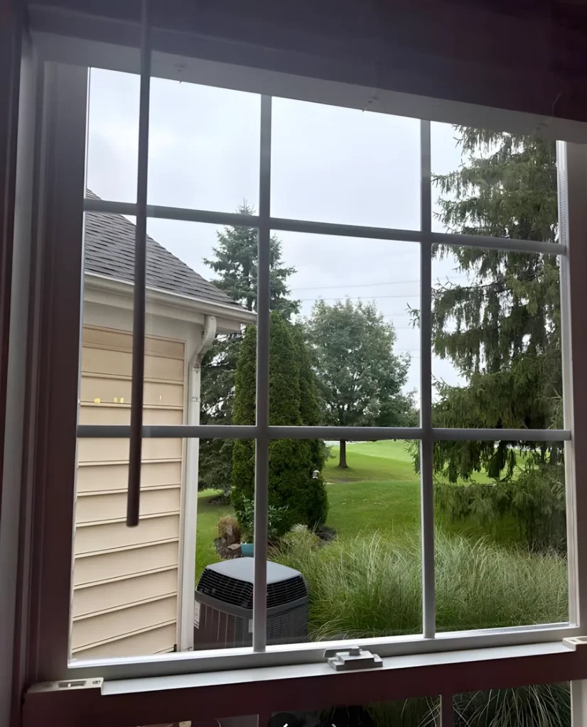 The same window with a clean pane and the grille bars in place