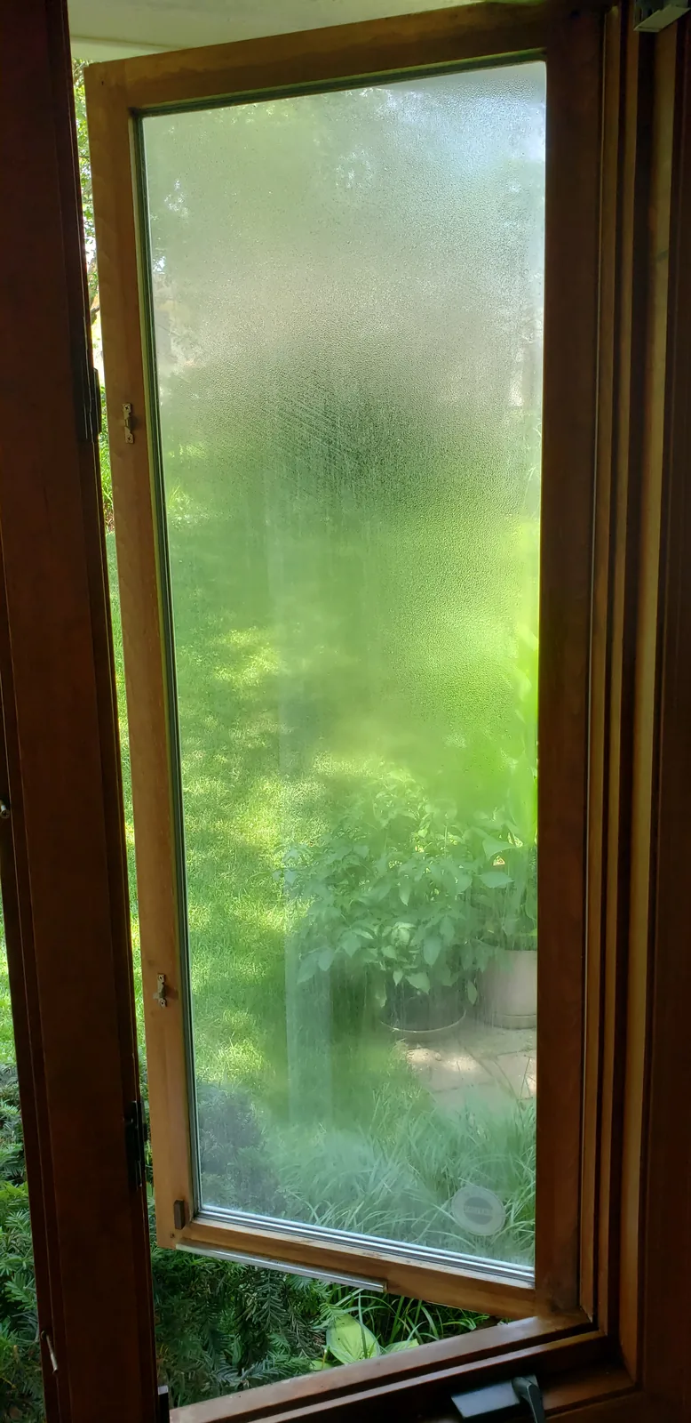 Foggy window glass before insulated glass replacement